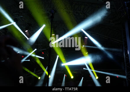 Spotlight with laser rays Stock Photo