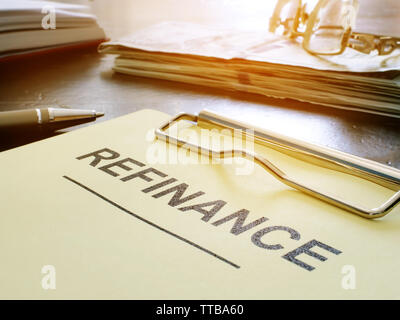 Refinance concept. Stack of business documents on table. Stock Photo