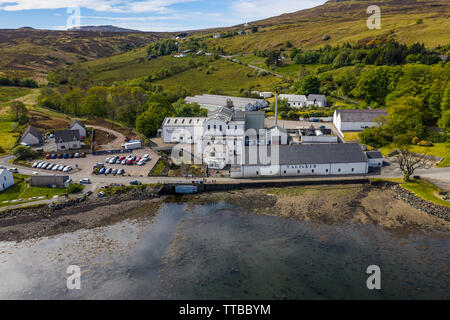 Aerial view of the Talisker Distillery, a single malt Scotch whisky distillery, on the west coast of Skye on the shores of Loch Harport in Carbost on Stock Photo