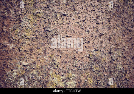 Picture of a rusty and mossy wall, color toned abstract background or texture. Stock Photo
