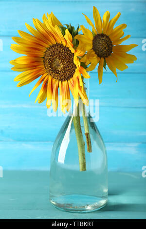 Beautiful sunflowers in vase on wooden background Stock Photo