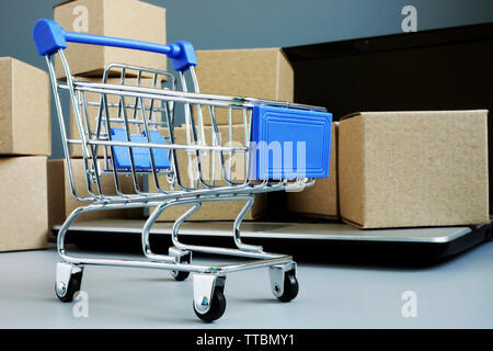 Delivery service. Shopping card and boxes from online shop. Stock Photo