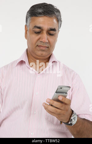 Businessman text messaging Stock Photo