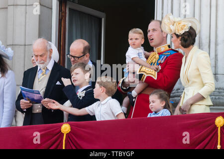 5 year old Prince George of Cambridge grabs the RAF flypast booklet from Prince Michael of Kent's hands.Buckingham Palace Balcony, Trooping the Colour Stock Photo