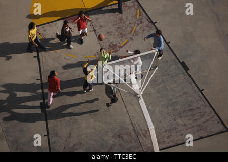 Friends playing basketball Stock Photo