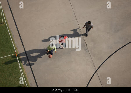 Friends playing basketball Stock Photo