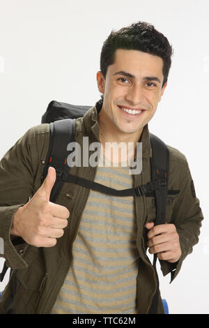 Male hiker showing thumbs up and smiling