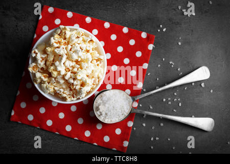 Salted popcorn in bowl on napkin Stock Photo