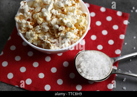 Salted popcorn in bowl on napkin Stock Photo