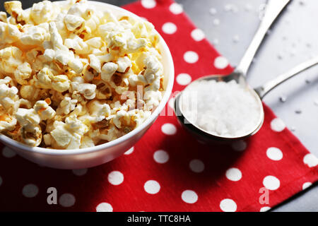 Salted popcorn in bowl on napkin Stock Photo