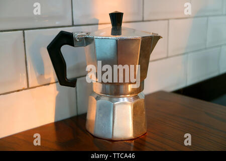 Moka Coffee Pot Isolated on the Kitchen's Wooden Table Stock Photo