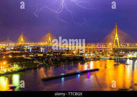 Bhumibol Bridge is one of the most beautiful bridges in Thailand and area view for Bangkok with thunderclap. Name of bridge comes from the name of The Stock Photo