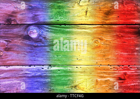 Concept of ecology and tolerance. Rainbow colored weathered wooden boards. Stock Photo