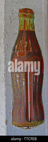 Faded vintage Coca-Cola thermometer ad in a hardware store Stock Photo