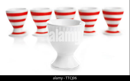 Red and White stripe egg cups, isolated on white Stock Photo