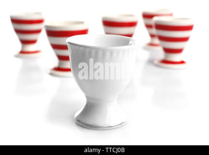 Red and White stripe egg cups, isolated on white Stock Photo