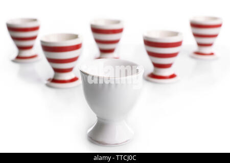 Red and White stripe egg cups, isolated on white Stock Photo