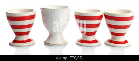 Red and White stripe egg cups, isolated on white Stock Photo