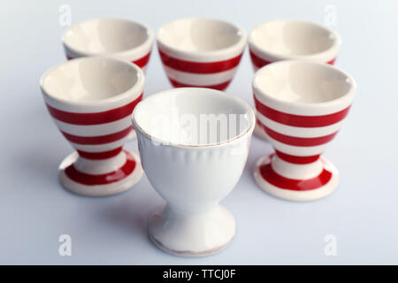 Red and White stripe egg cups, isolated on white Stock Photo