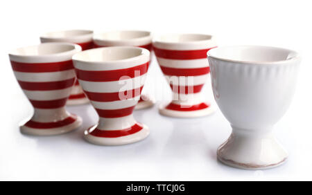 Red and White stripe egg cups, isolated on white Stock Photo