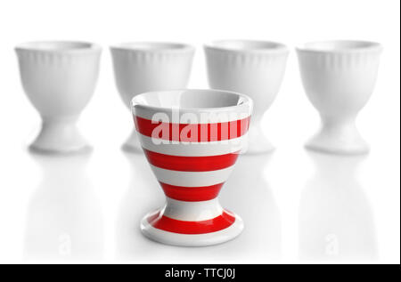 Red and White stripe egg cups, isolated on white Stock Photo