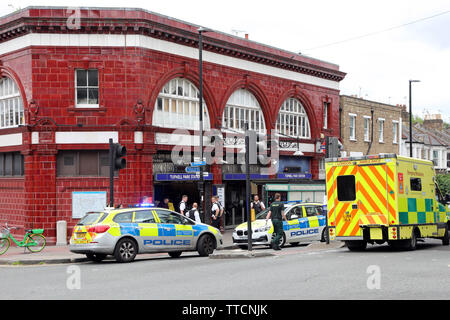 London, UK. 16th June 2019. Police attend a stabbing incident at Tufnell Park Station, Tufnell Park, London where a 15 year old boy was stabbed in the face in Brecknock Road. Several police cars and an ambulance attended the incident by Tufnell Park station and are seen outside the My Shop supermarket and searching the nearby station for suspects. Credit: Paul Brown/Alamy Live News Stock Photo