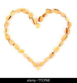 Heart shaped peanuts isolated on white Stock Photo