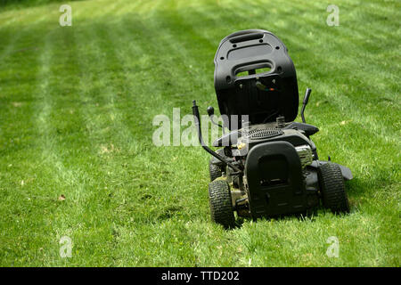 lawn mowers on the freshly mowed field Stock Photo