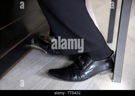 Musician teacher trains to play piano little girl, underside view Stock Photo