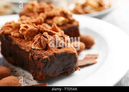 Pieces of chocolate cake with walnut on the table, close-up Stock Photo