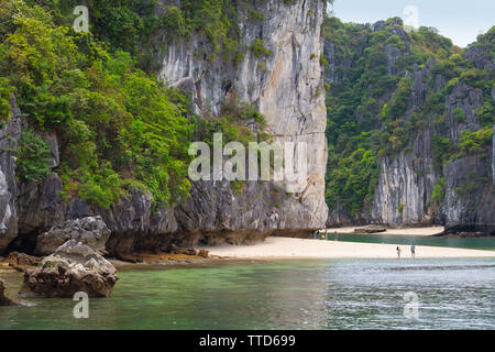 White sand beach an a limestone island in Ha Long Bay near Cat Ba Island, Hai Phong Province, Vietnam, Asia Stock Photo
