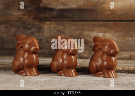 Chocolate Easter bunnies on wooden background Stock Photo