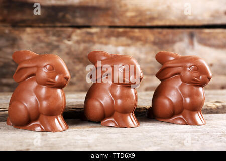Chocolate Easter bunnies on wooden background Stock Photo