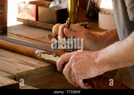 Priming a flintlock Stock Photo