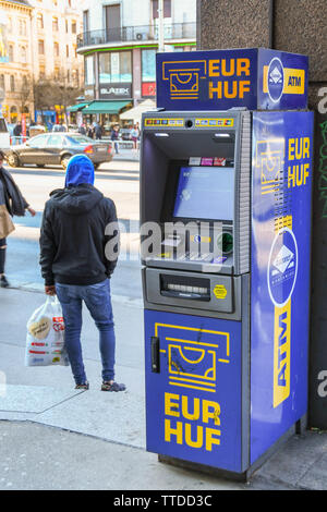 BUDAPEST, HUNGARY - MARCH 2018: Free-standing cash machine for euros or the Hungarian Forint on a street in the centre of Budapest. Stock Photo