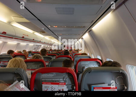 Inside view from a passengers seat of a  Boeing 737 aircraft