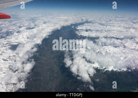 View from a cabin window of a Boeing 737 above the clouds Stock Photo