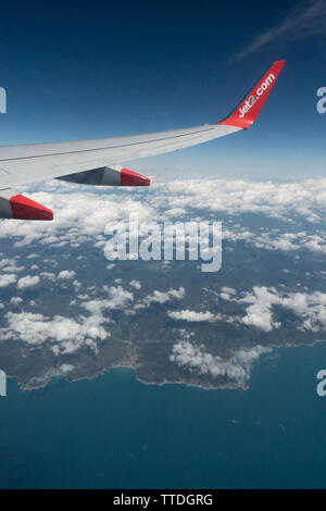 View from a cabin window of a Boeing 737 above the clouds Stock Photo
