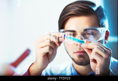 Young medical technician working in laboratory Stock Photo