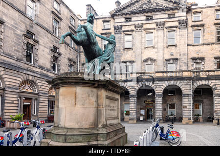 The statue (1884, Sir John Steell) of Alexander taming Bucepalus in the quadrangle of Edinburgh City Chambers, (1761, John Adam) off the Royal Mile. Stock Photo