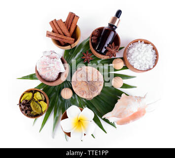 Beautiful spa setting on palm leaf, isolated on white Stock Photo