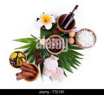 Beautiful spa setting on palm leaf, isolated on white Stock Photo