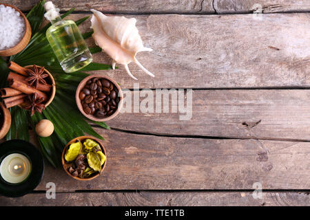 Beautiful spa setting on palm leaf on wooden table Stock Photo