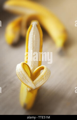 Heart made of banana on wooden background Stock Photo