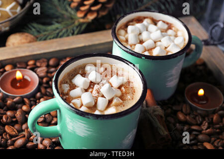 https://l450v.alamy.com/450v/tted3h/two-mugs-of-hot-cacao-with-marshmallow-on-coffee-beans-tted3h.jpg