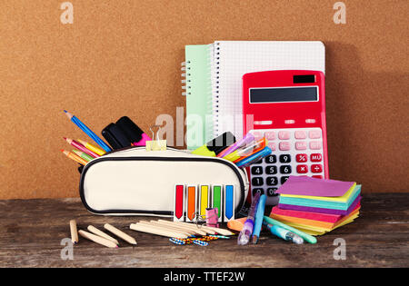 Pencil case with various stationery on old  wooden table Stock Photo