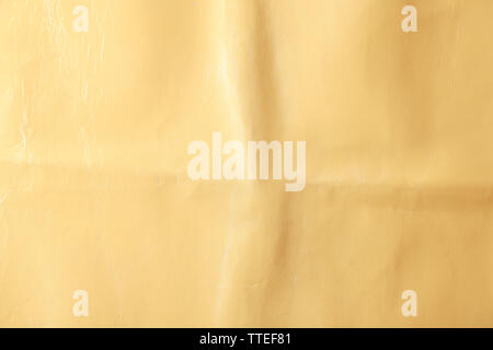 Beige leather texture with crumpled uneven surface Stock Photo