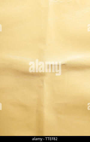 Beige leather texture with crumpled uneven surface Stock Photo