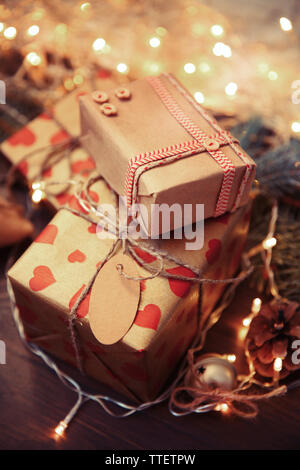 Homemade wrapped Christmas gifts on a table Stock Photo