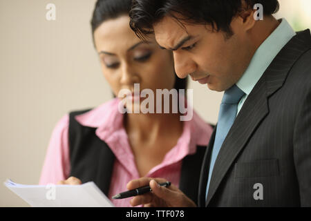 Indian two business executives going over documents Stock Photo